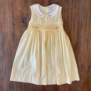 Fantaisie Kids Smocked yellow pinstripe dress with Peter Pan collar.